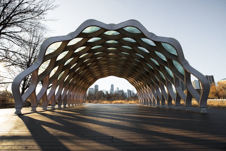 Contemporary architectural exhibit at Lincoln Park Zoo in Chicago with skyline view.